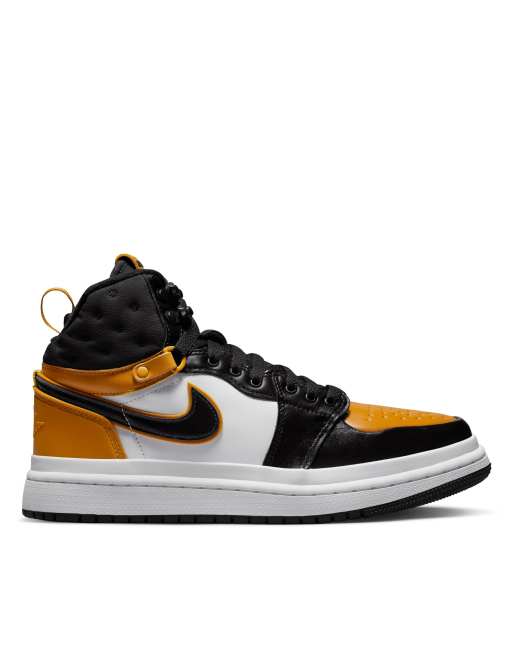 Nike Air Jordan 1 Elevate Mid sneakers in orange, black and white 