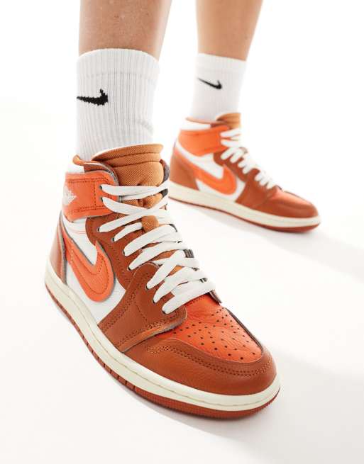 Nike Air Jordan 1 high sneakers in white and orange