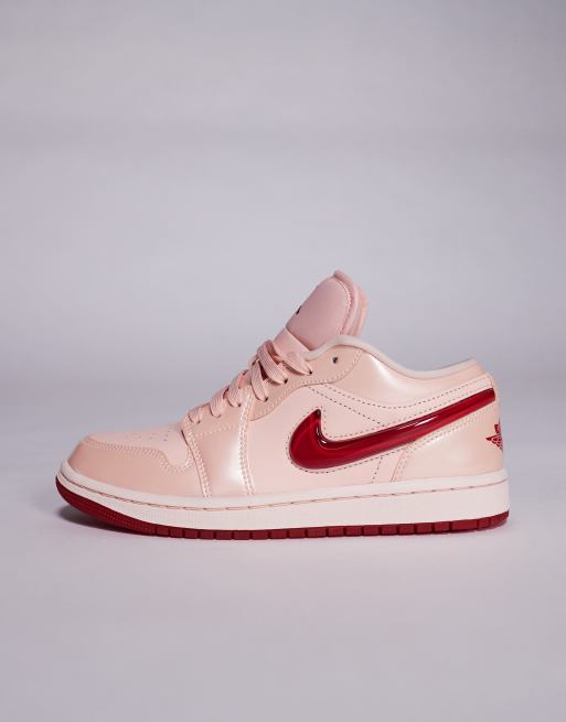 Nike Air Jordan 1 Low sneakers in light orange and pink
