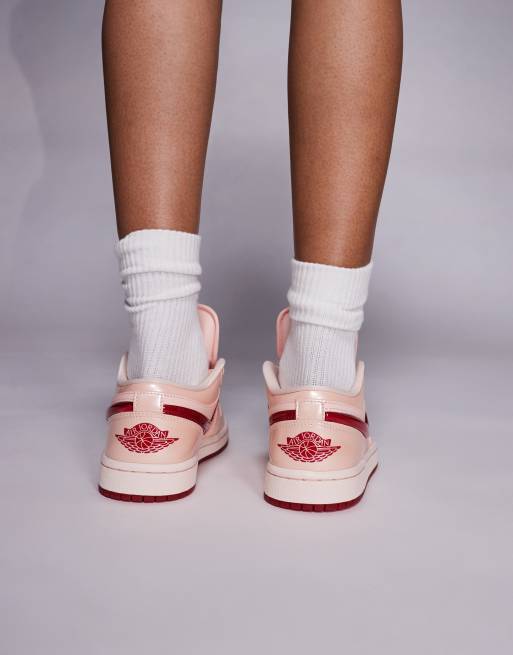 Nike Air Jordan 1 Low sneakers in light orange and pink