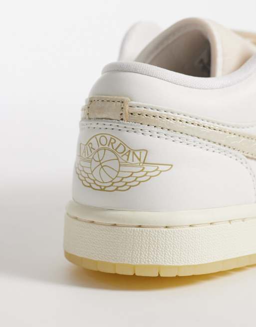 Nike Air Jordan 1 Low sneakers in off white and gold, 2 of 5