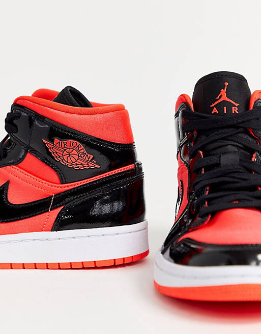 Nike Air Jordan 1 mid red and black trainers