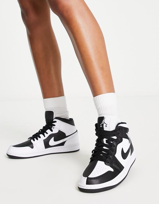Nike Air Jordan 1 Mid sneakers in white and black 