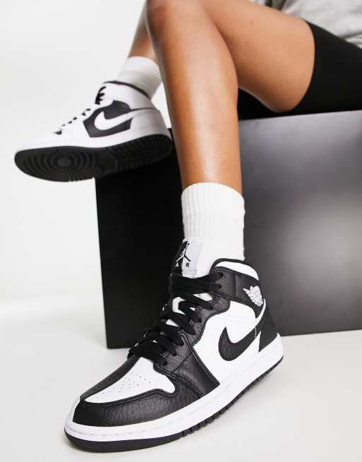 Nike Air Jordan 1 Mid sneakers in white and black