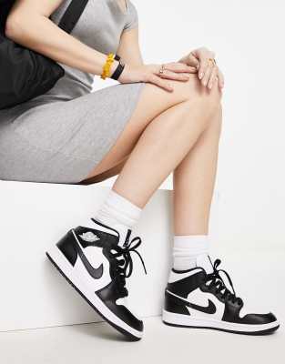 Nike Air Jordan 1 Mid sneakers in white and black