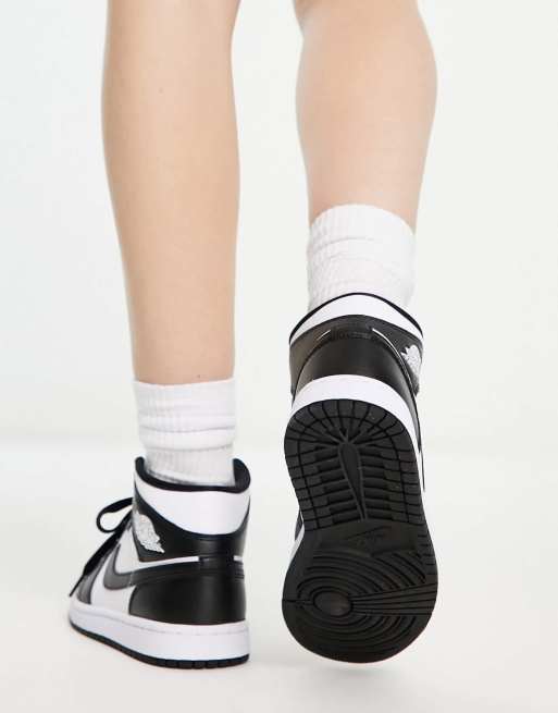 Nike Air Jordan 1 Mid sneakers in white and black