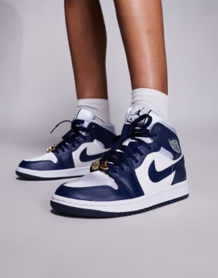 Nike Air Jordan 1 Mid sneakers in white and navy