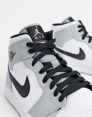 Nike Air Jordan 1 Mid trainers in grey 
