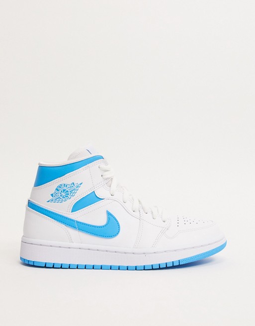 Nike Air Jordan 1 mid trainers in white and blue