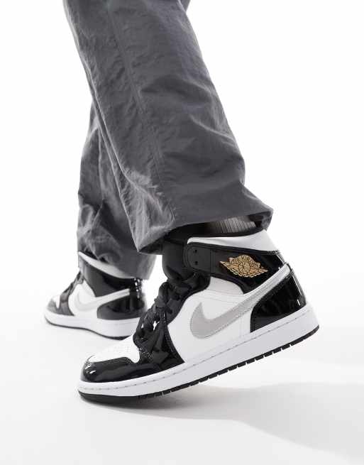 Nike –Air Jordan 1 Mid– Vita, svarta och silverfärgade sneakers med medelhöga skaft
