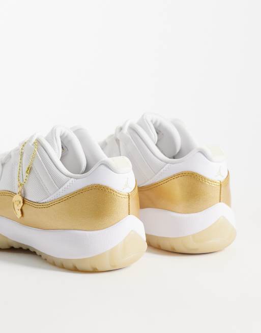 Nike Air Jordan 11 Retro Low sneakers in white and gold | ASOS