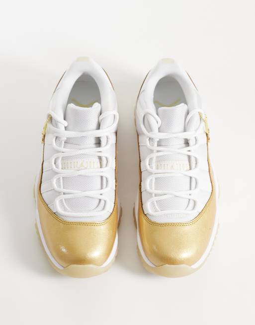 Nike Air Jordan 11 Retro Low sneakers in white and gold | ASOS