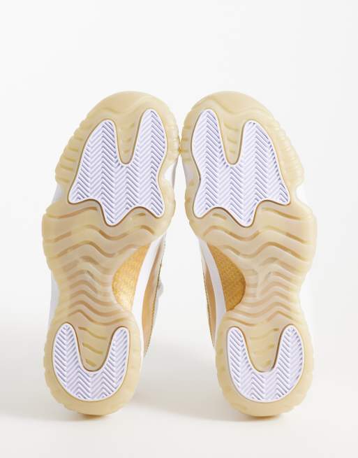 Nike Air Jordan 11 Retro Low sneakers in white and gold | ASOS