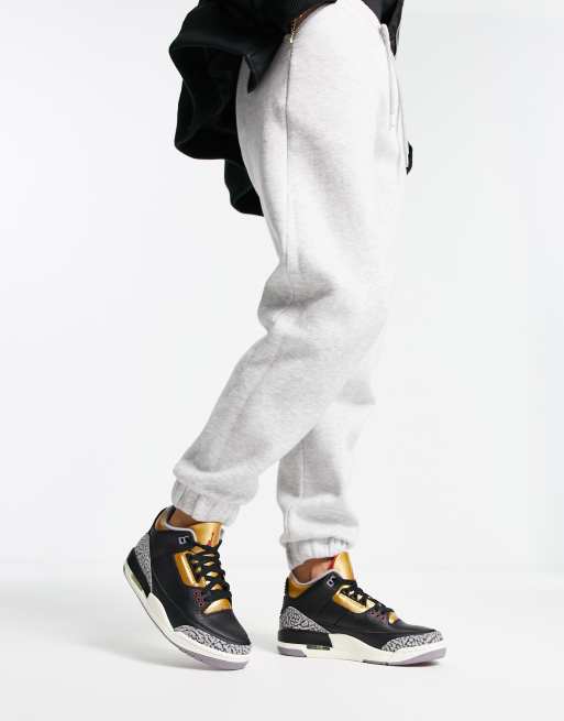 Jordan sweatpants black online and gold