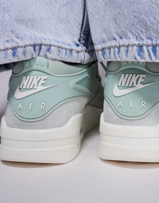 Nike Air Jordan 4 Retro trainers in green and cream
