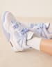 Nike Air Jordan 4 Retro sneakers in white and light blue