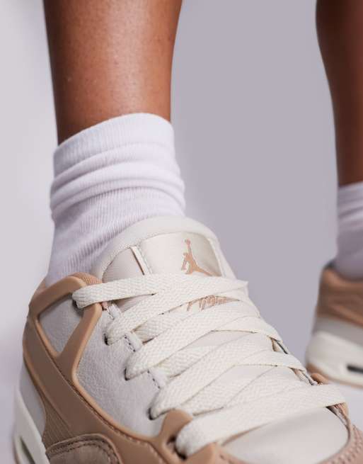 Nike Air Jordan 4 RM trainers in beige and white