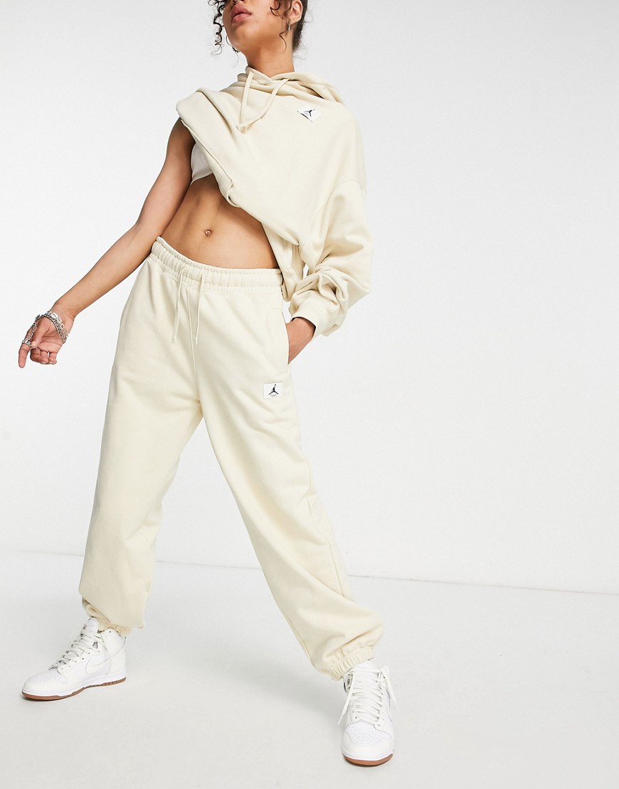 Nike Air Jordan essential fleece sweatpants in cream-Neutral