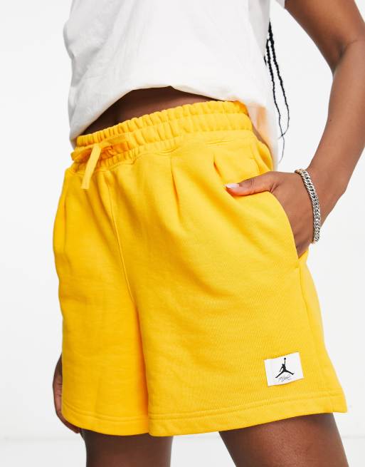 yellow nike fleece shorts