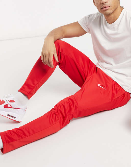 Nike swoosh 2025 joggers red