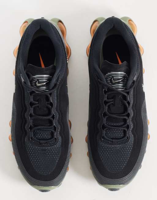 Nike Air Liquid Max trainers in black and orange, 3 of 5
