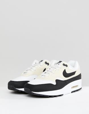 nike cream and black trainers