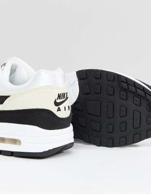 nike cream and black trainers