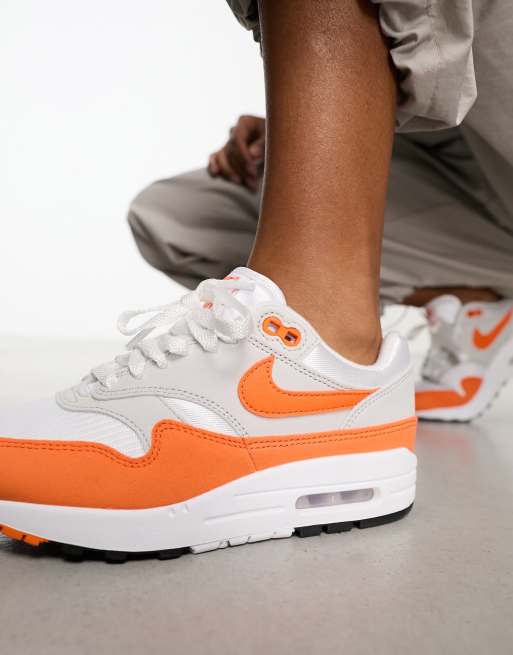 Nike Air Max 1 sneakers in gray and safety orange ASOS