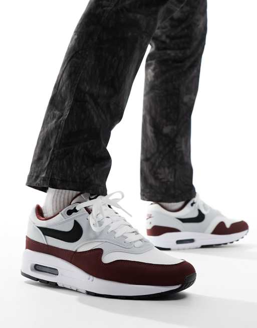 Nike Air Max 1 trainers in white and dark team red