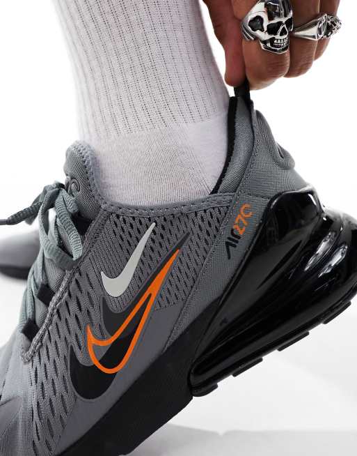 Black nike shoes with best sale orange swoosh