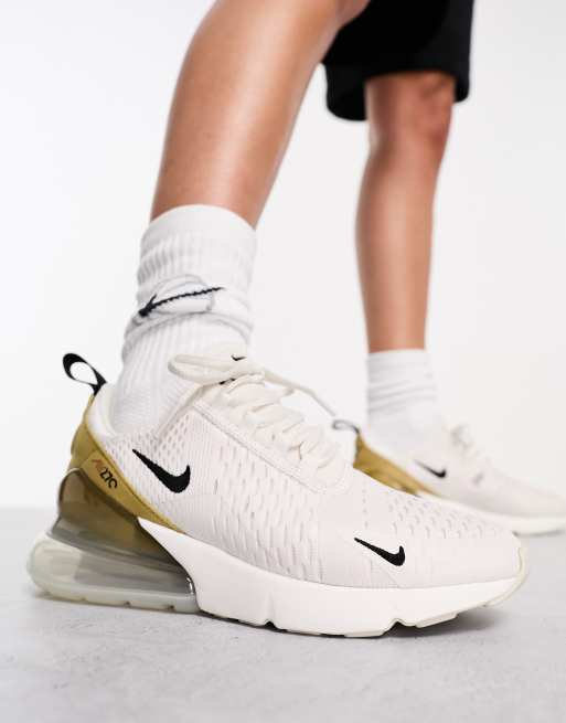 Nike Air Max 270 trainers in white and gold