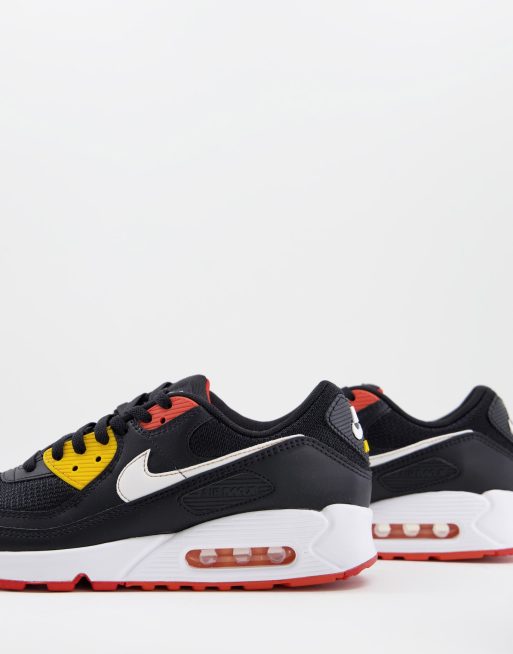 Nike Air Max 90 in black and orange