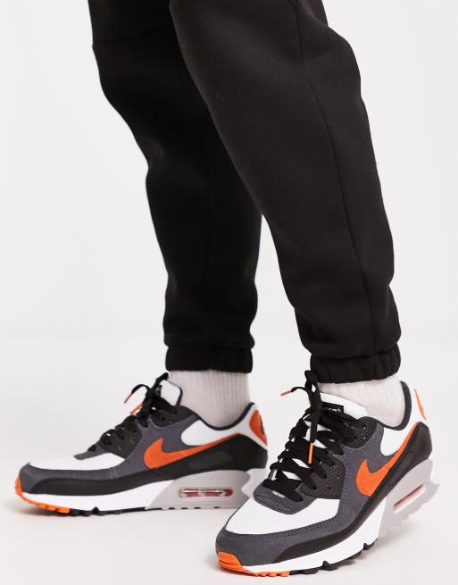 Black and clearance orange nike sneakers