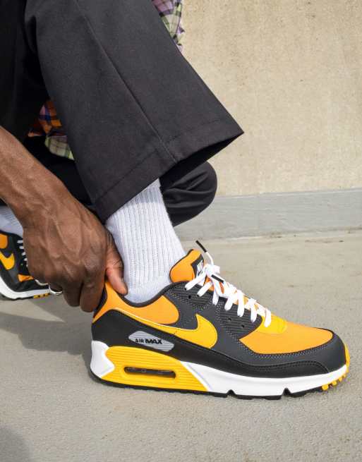 Nike black and sale yellow trainers