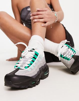Nike Air Max 95 trainers in black and stadium green