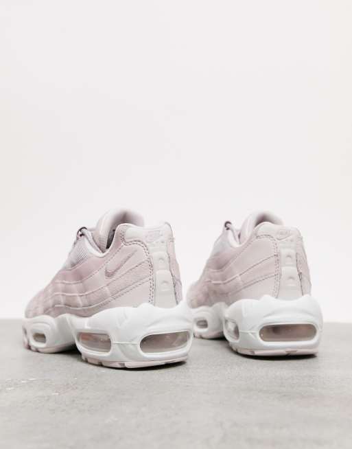 Nike Air Max 95 trainers with soft pink