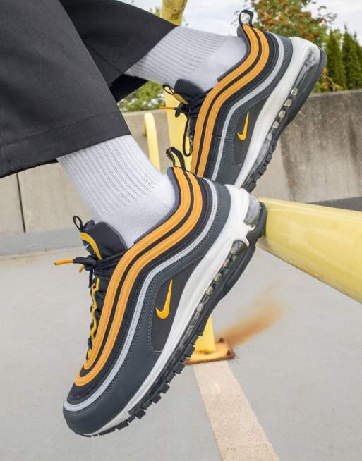 Nike Air Max 97 trainers in black and university gold