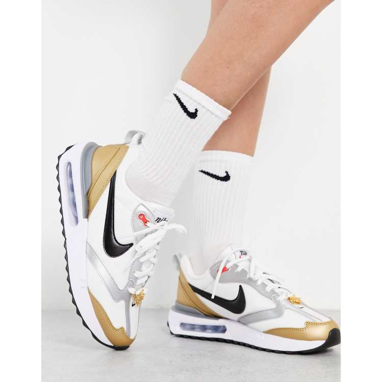 Nike gold hotsell and white shoes