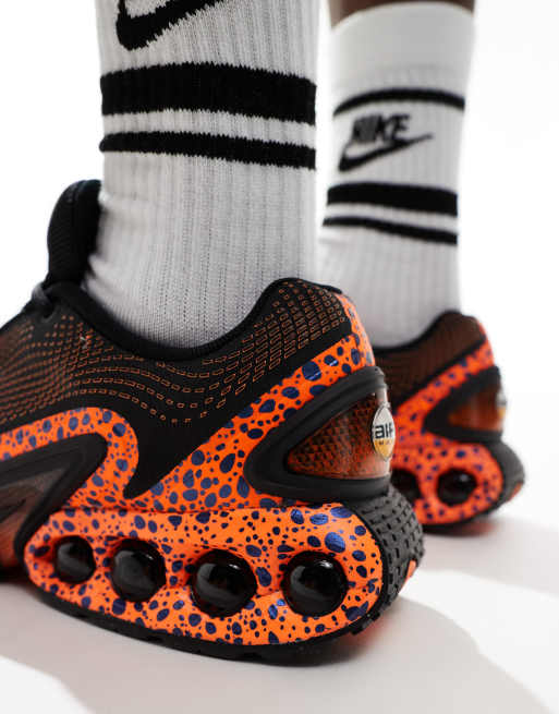 Nike Air Max DN sneakers in black and orange