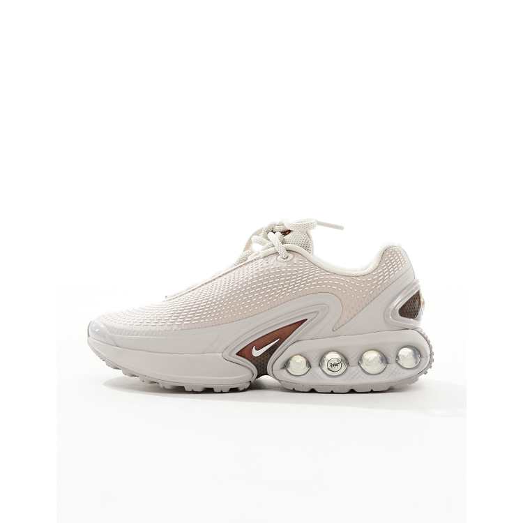 Nike Air Max DN unisex trainers in beige and silver ASOS