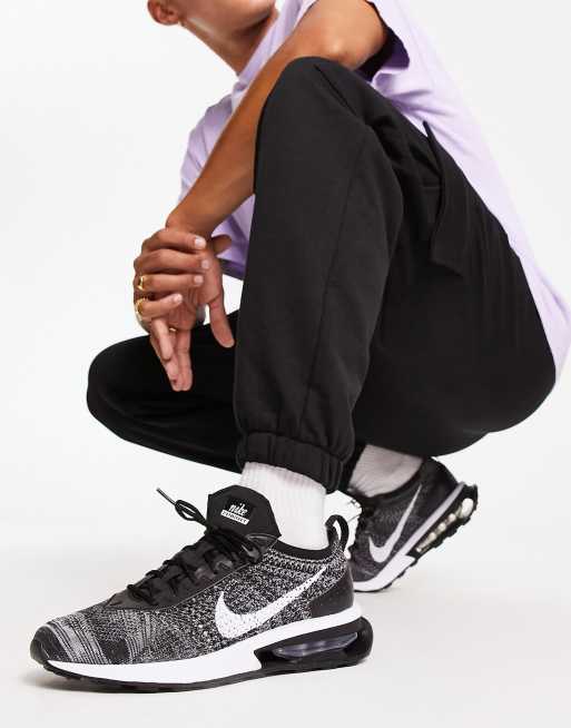 Nike Air Max Flyknit Racer sneakers in black and white ASOS