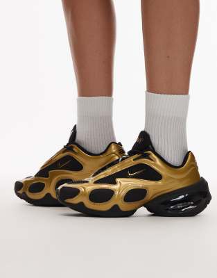 Nike Nike Air Max Muse trainers in black and gold