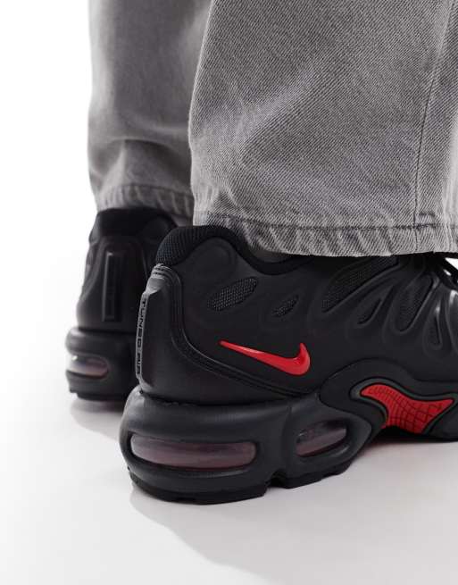 Nike Air Max Plus Drift sneakers in black and red
