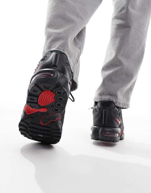 Nike Air Max Plus Drift sneakers in black and red