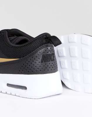 nike thea black and gold