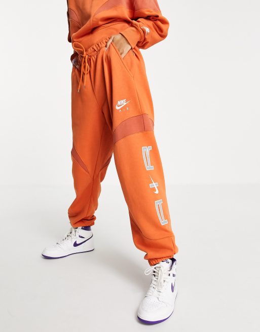 Orange nike jogging on sale pants