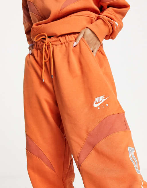 NIKE OVERSIZE JOGGERS ORANGE - TROUSERS WOMEN