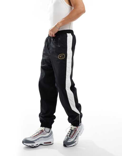 Nike Air Pantalon de jogging a logo virgule Noir blanc