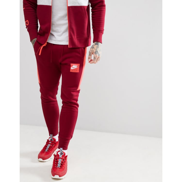 Jogging rouge nike discount homme