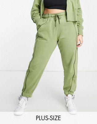 Nike Air Plus crop mid rise piping detail joggers in alligator green - ASOS Price Checker